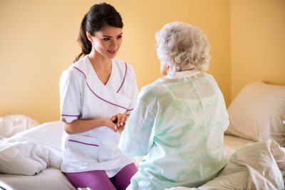 caregiver talking to senior woman