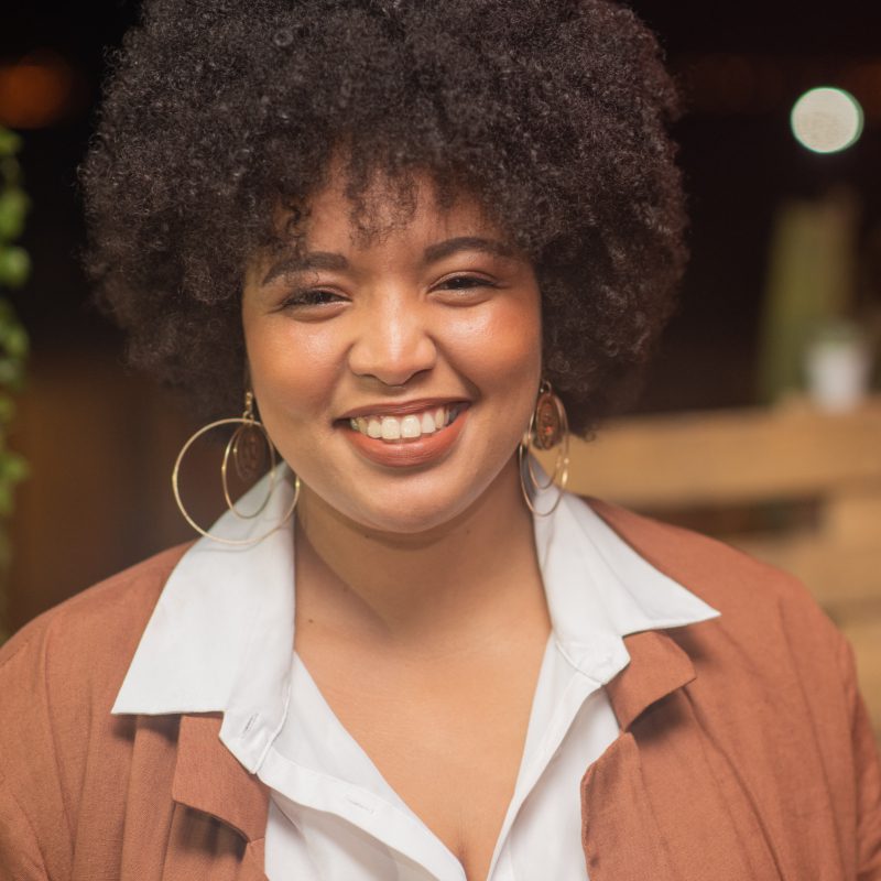 Portrait of beautiful smiling woman with afro hair