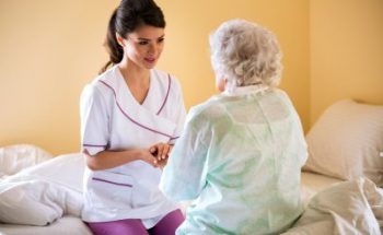 caregiver talking to senior woman