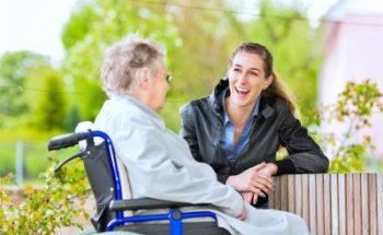 caregiver and senior woman talking