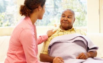 woman looking after sick patient