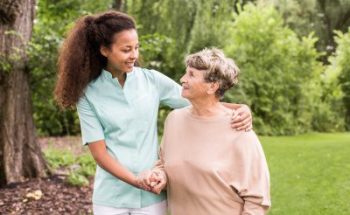 Nurse is walking around with elder lady