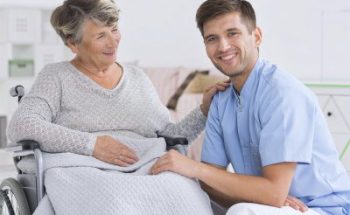 caregiver and senior woman smiling