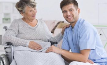caregiver and senior woman smiling
